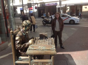 A very-believable street performer posing as a statue.